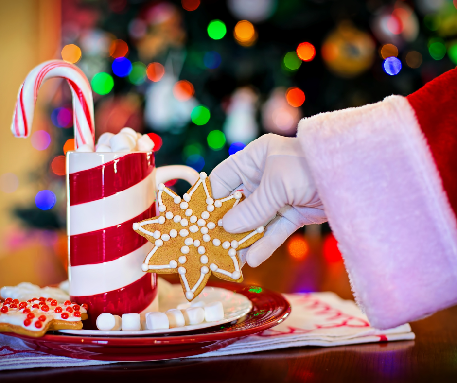 Santa's hand holding a cookie